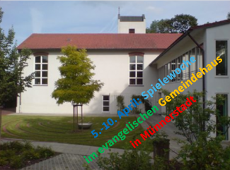 Kirche und Gemeindehaus in Münnerstadt mit Schriftzug "5.-10. April Spielewoche..."